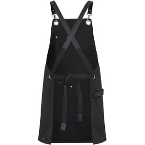 A black canvas apron with brass eyelets and PU straps featuring a front pocket and tie waist.