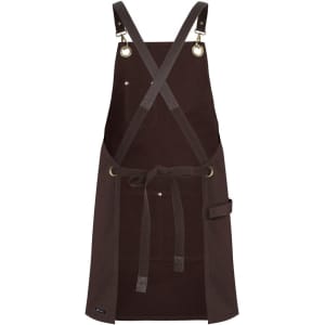 A brown canvas apron with brass eyelets and PU straps, featuring an adjustable crossback design and a side pocket.