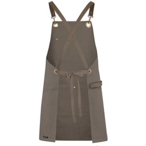 A brown canvas apron featuring brass eyelets and a PU strap, with a waist tie and a side pocket.