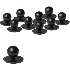 A set of black chef's buttons featuring a round ball on a flat base, arranged in groups of eleven.