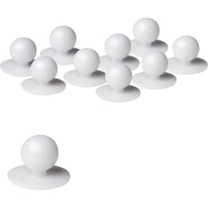 A set of white chef's buttons in various positions, featuring round tops and flat bases.