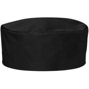 A black chef's cap made from fabric, featuring a rounded design and a simple style. It includes branding.