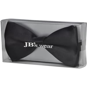 A black bow tie packaged in a clear box, featuring a logo on the front.
