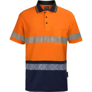 High-visibility polo shirt in orange and navy, featuring reflective segmented tape and a pocket. Brand logo present.