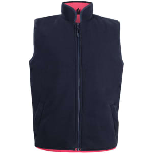 A navy reversible vest with a high collar and zippers, featuring contrasting red lining and pockets.