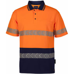 An orange polo shirt with grey reflective stripes and a navy blue bottom section, featuring a pocket and logo.