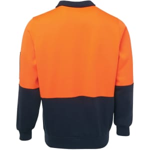 An orange and navy fleece top with long sleeves and a collar. Features a logo on one sleeve.