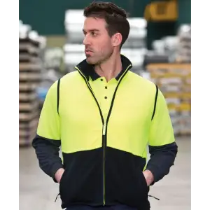 A high-visibility polar vest in bright yellow and black, featuring a zip and collar, worn by a man.