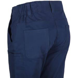 Navy cargo pants featuring multiple pockets and elastic waist detailing. Includes a logo on the garment.