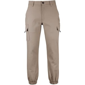A pair of beige jogger cargo pants with multiple pockets and elastic cuffs. Features branding on the fabric.