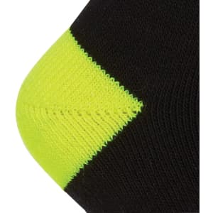 A black sock with a bright yellow reinforced toe, featuring a logo on its side.