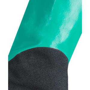 A close-up of a green nitrile chemical glove with a black underside, showcasing its glossy finish and design.