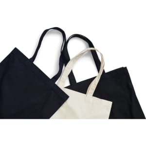 Three heavy tote bags in black and cream, featuring strap handles and a simple design. One bag has a logo.