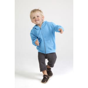 A light blue zip hoodie on a smiling child, running with joy, paired with dark pants and sandals.