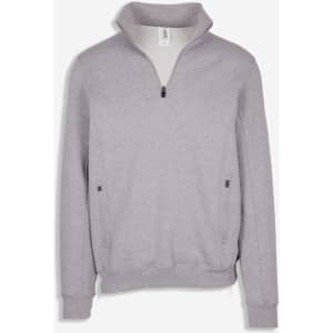 A grey half-zip fleece jumper with a collar and side pockets. It features a subtle logo.
