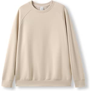 A beige adults' cotton sweatshirt with a relaxed fit and raglan sleeves. It has a logo on a tag.