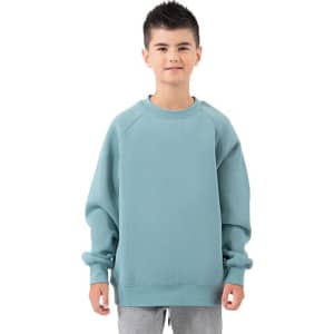A child wearing a light blue cotton sweatshirt, featuring a relaxed fit and ribbed cuffs, with a logo on the front.