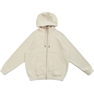 A zip-up hoodie in a light beige colour with a kangaroo pocket and a hood, featuring a logo.