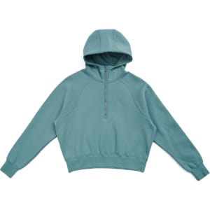 A half-zip jumper in a soft teal colour with a hood and long sleeves, featuring a logo on the front.