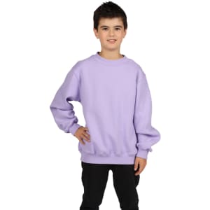 A boy wearing a lilac crew neck jumper, posing with one hand on his hip against a white background.