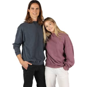 Unisex stone wash sweatshirts in dark grey and mauve, featuring relaxed fits and a logo.