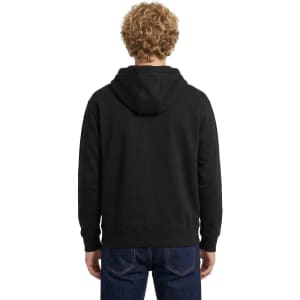 A blue men's brushed heavy fleece hoodie with a front pocket and a logo on the chest, modelled by a smiling man.