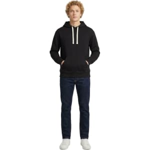 A blue men's brushed heavy fleece hoodie with a kangaroo pocket, worn by a model facing away from the camera.