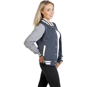 A women's junior varsity jacket in navy and grey, featuring white stripes and pockets, displayed on a model.