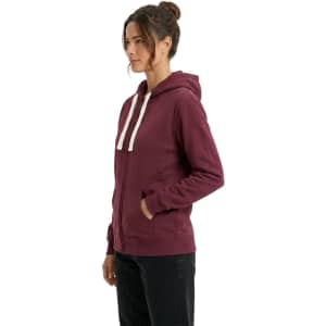 A blue women's heavy zip fleece hoodie featuring a front pocket and a hood, paired with black leggings.