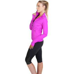 A woman models a bright pink women's AVA nylon/spandex jacket paired with black leggings. The jacket has a logo.