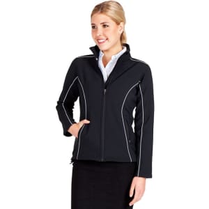 A woman wears a black Women's Tempest Plus Jacket with white piping details, featuring a zippered front and pockets.