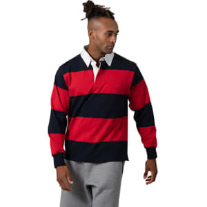 A man models a unisex rugby polo featuring red and navy stripes with a white collar. The design includes a logo.