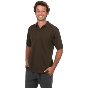 A man wearing a dark green cotton polo shirt with a logo, posing casually with hands in pockets.