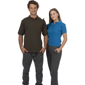 A man in a brown polo shirt and a woman in a blue polo shirt, both wearing grey pants, stand side by side. The shirts feature logos.