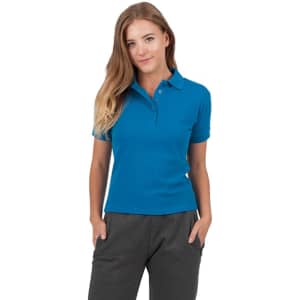 A woman wearing a vibrant blue cotton polo shirt with a collar and buttons, paired with grey pants.