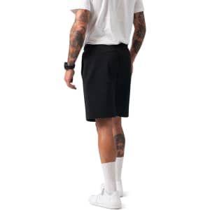 Men's cotton sandwich shorts in black, featuring a classic design and a logo, showcased from the rear with a model.