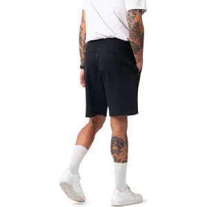Men's cotton shorts in black, featuring a comfortable waistband and side pockets, displayed from a rear angle.
