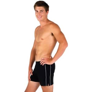 A man in fitted black sports shorts with white detailing, standing sideways against a plain background.