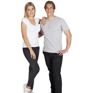 A woman in a white Hanley T-shirt and black jeans stands beside a man in a grey Hanley T-shirt and black pants.