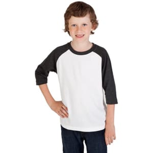 A 3/4 raglan sleeve T-shirt in white with dark grey sleeves, worn by a smiling child. The shirt features a logo.