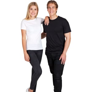 A white modern fit tee on a woman and a black modern fit tee on a man, both standing together.