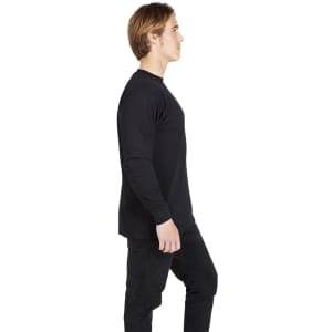 A black long sleeve T-shirt displayed on a model, featuring a simple design and a casual fit.