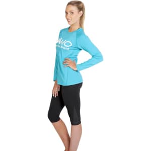 A teal long sleeve T-shirt paired with black leggings, featuring a logo on the front.