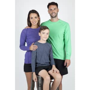 A purple long sleeve T-shirt on a woman, a green one on a man, and a grey one on a boy, all smiling.