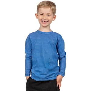 A boy smiles while wearing a long sleeve, stone wash T-shirt in blue. The shirt has a logo on it.