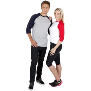 A man in a grey and navy raglan T-shirt and a woman in a red and white raglan T-shirt pose together.