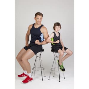 A man and boy sit on stools, both wearing black singlets with contrasting blue and green accents, showing off their muscles.