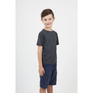 A child wearing a grey heather t-shirt and navy shorts, smiling and standing against a plain background.
