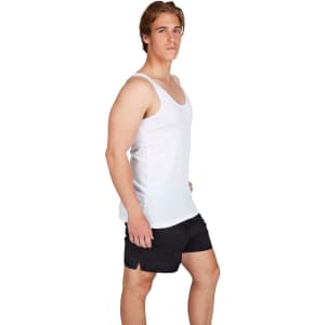 A man wearing a white American style singlet paired with black shorts, standing in profile.