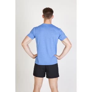 A man wearing a blue heather t-shirt and black shorts, standing with his hands on his hips.
